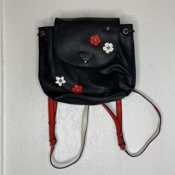 red backpack with white straps